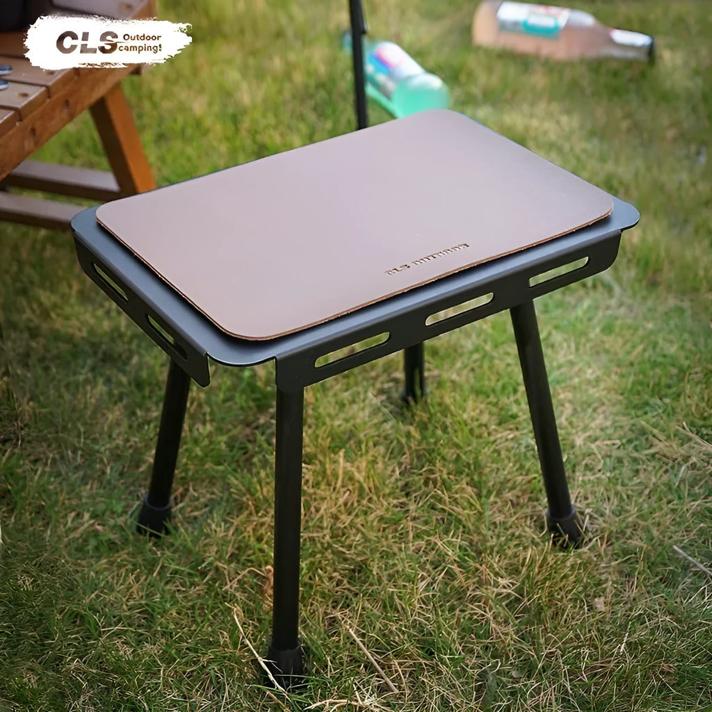 Aluminium alloy dual-use folding camping stool and table with green cushion.