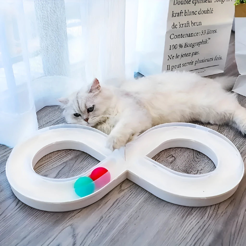 Blue and white plastic cat turntable track toy with balls and a feather teaser wand.