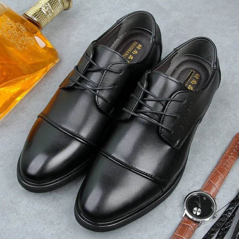 Men's black formal lace-up shoes with stitching detail on a rubber sole