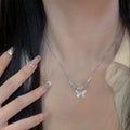 Silver butterfly jewellery set with hetian jade accents showing bracelet and necklace combination
