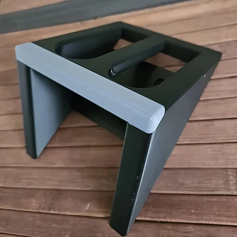 Black plastic punk-style pistol display stand for toy guns and replicas.