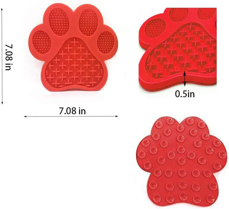 Bone-shaped blue silicone dog licking mat with suction cups on smooth surface