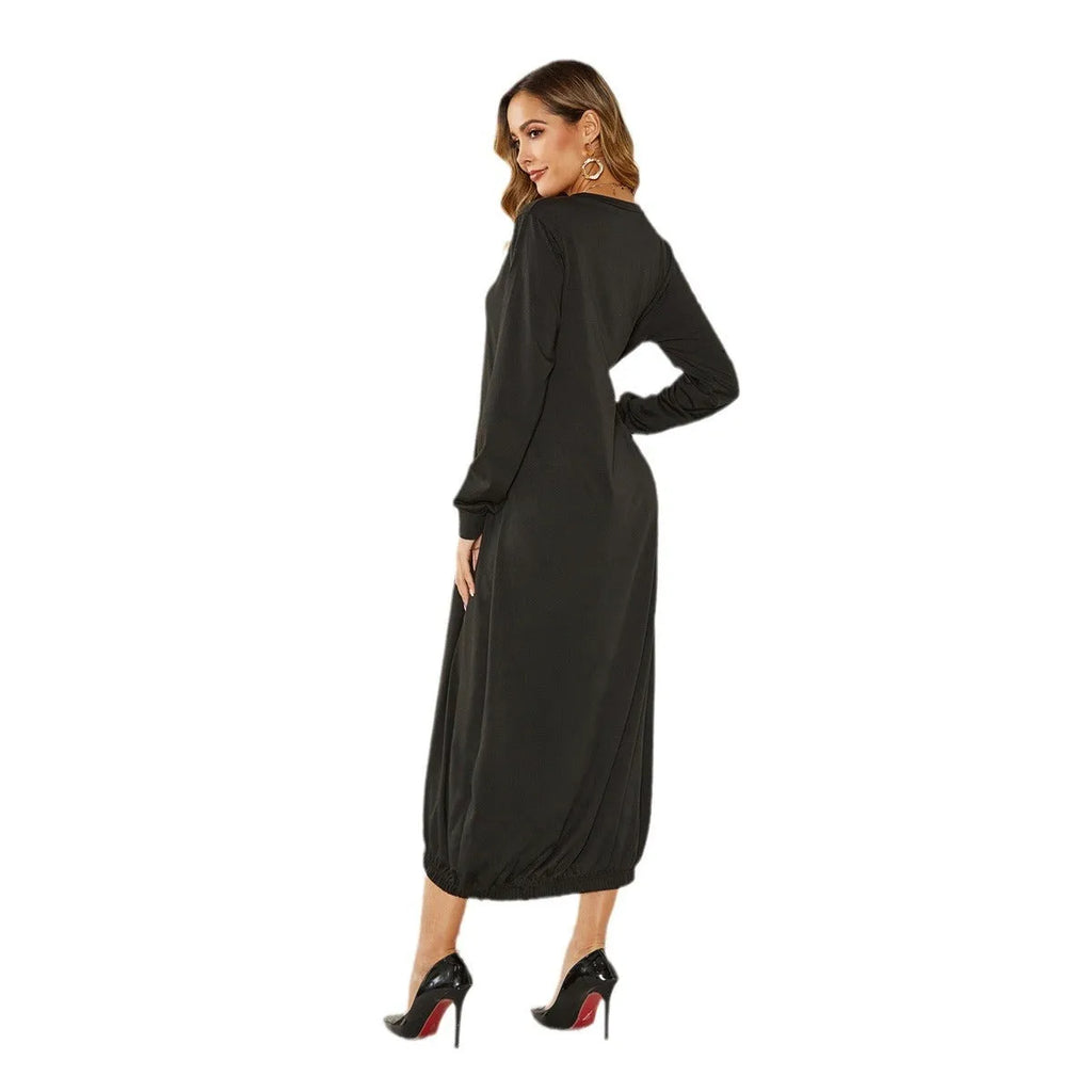 A loose long lantern dress with a lace-up crew neck, shown in grey.