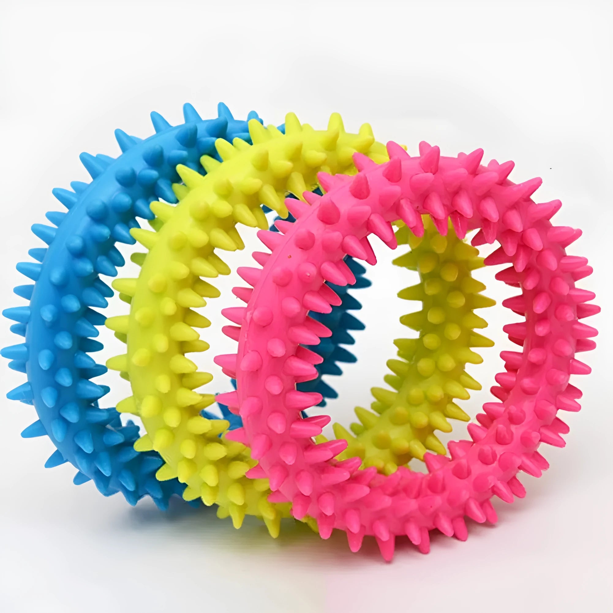 Blue TPR spiked ring dog chew toy for dental cleaning and bite training on a white background.