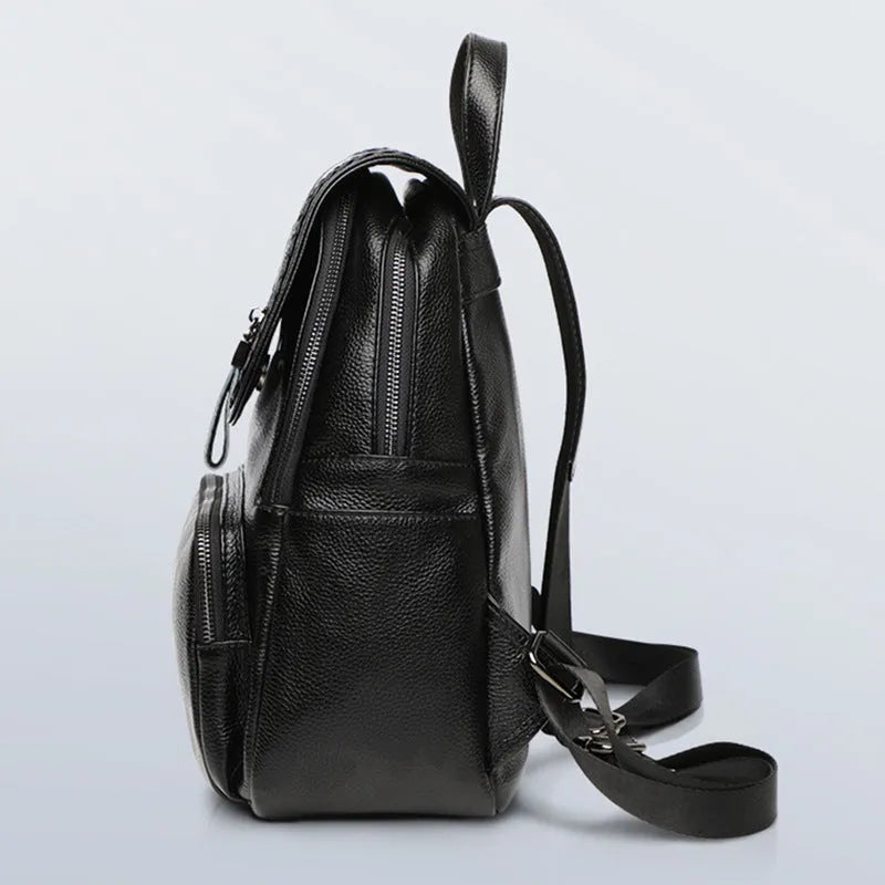 Blue genuine leather street trend women's backpack showing external sandwich pocket and zipper.