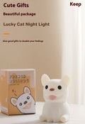 Silicone animal-shaped USB night light with touch dimming on a bedside table.