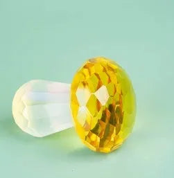 Colourful crystal mushroom decorative ornament in geometric modern style on a white background.