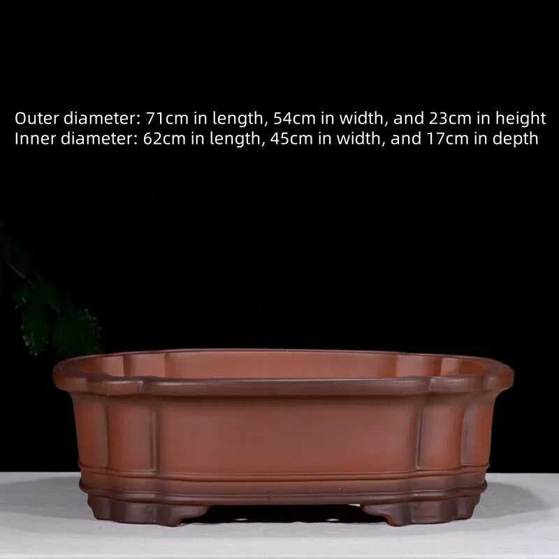 Large antique finish purple clay flower pot with Chinese tree stump design showing pine cypress pomegranate motifs