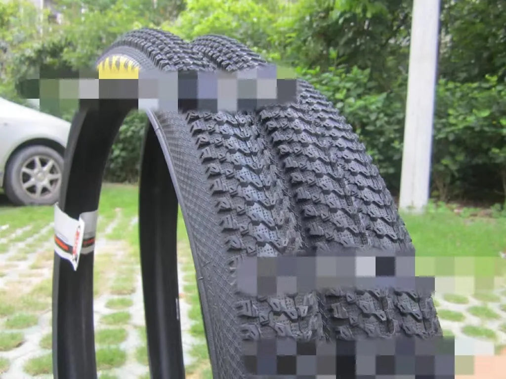 Mountain bike ultralight puncture-resistant tyre showing tread pattern and sidewall with size options
