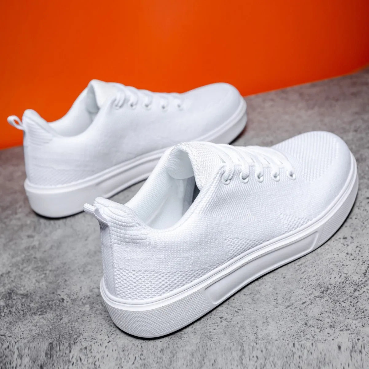 Light white and black mesh casual sneakers with flat EVA soles and round toes on a white background.