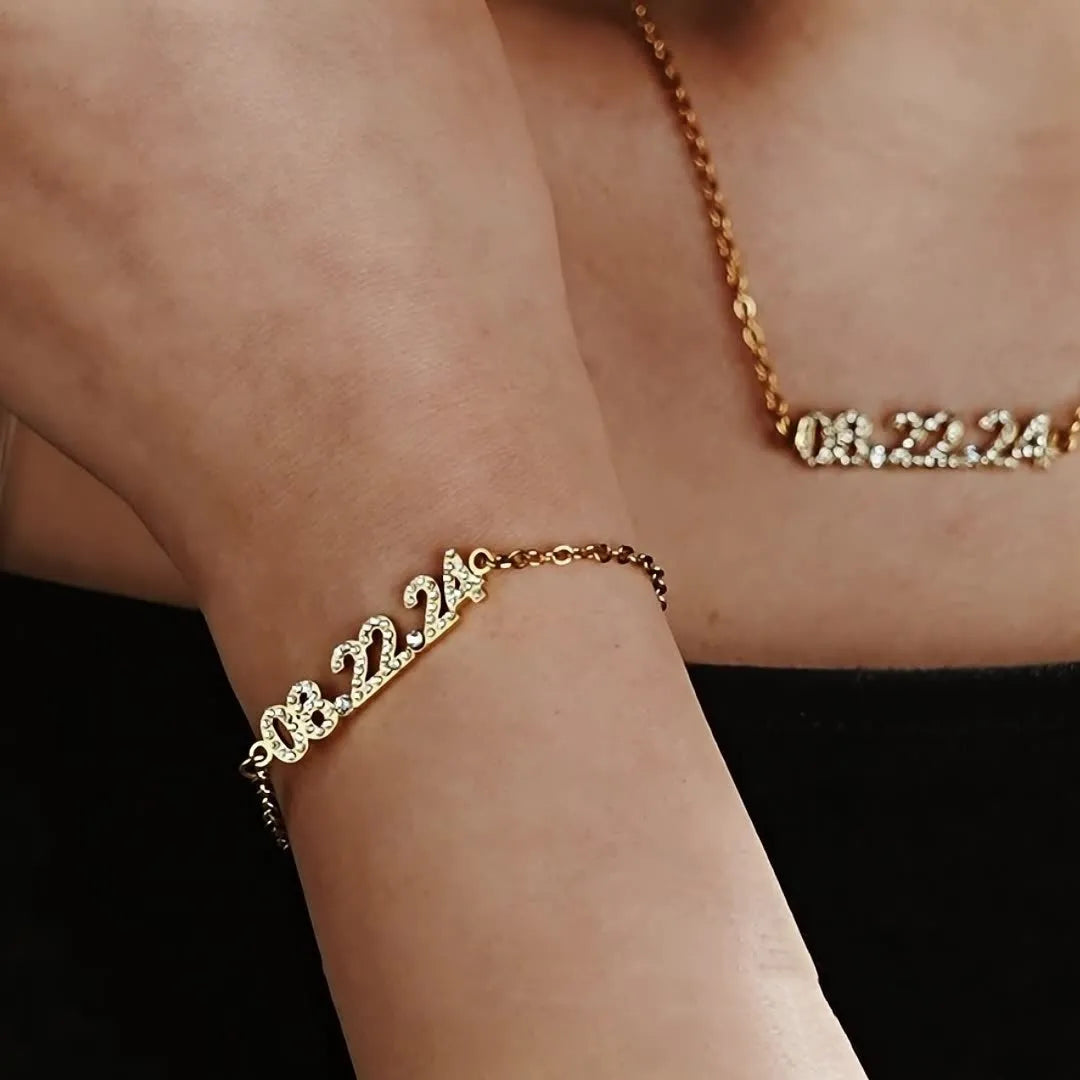 Stainless steel digital bracelet with diamond-set number display on wrist.