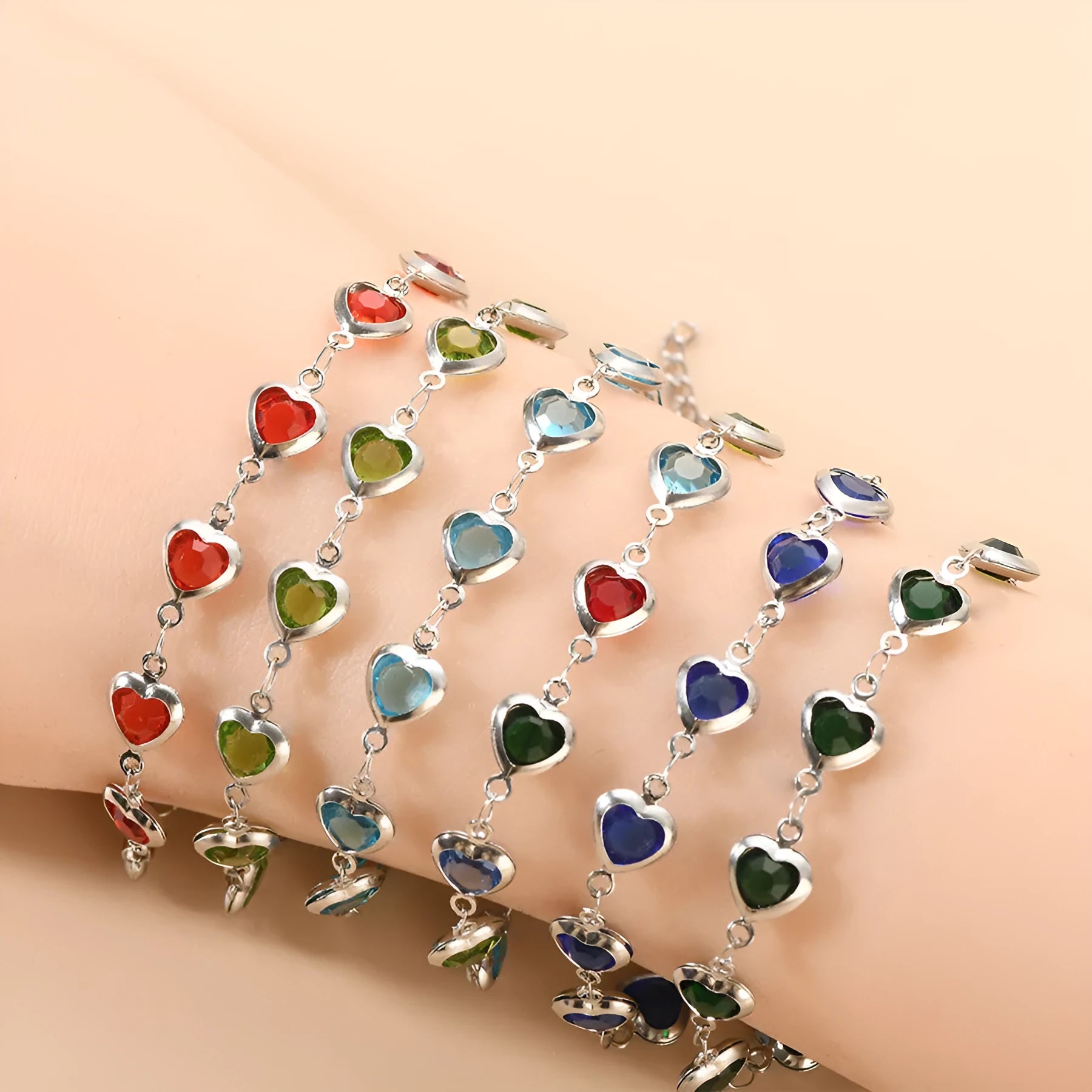 Stainless steel Devil's Eye geometric heart bracelet in red, blue, or green on a white background.