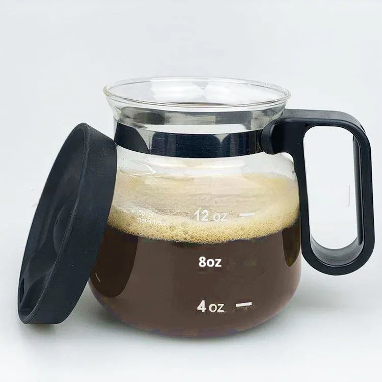 Transparent borosilicate glass coffee maker with removable silicone cover showing modern simple design