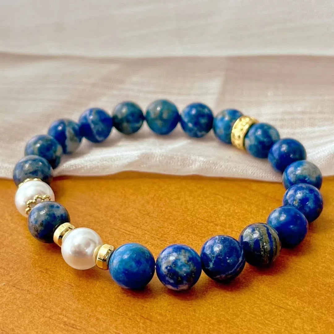 Chinese style lapis lazuli bracelet with green gold stone elements and artistic retro design