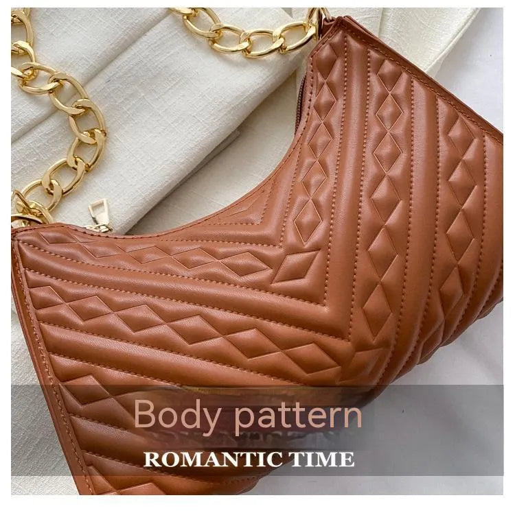 Brown pleated PU leather women's baguette shoulder bag with a chain strap and soft carry handle.