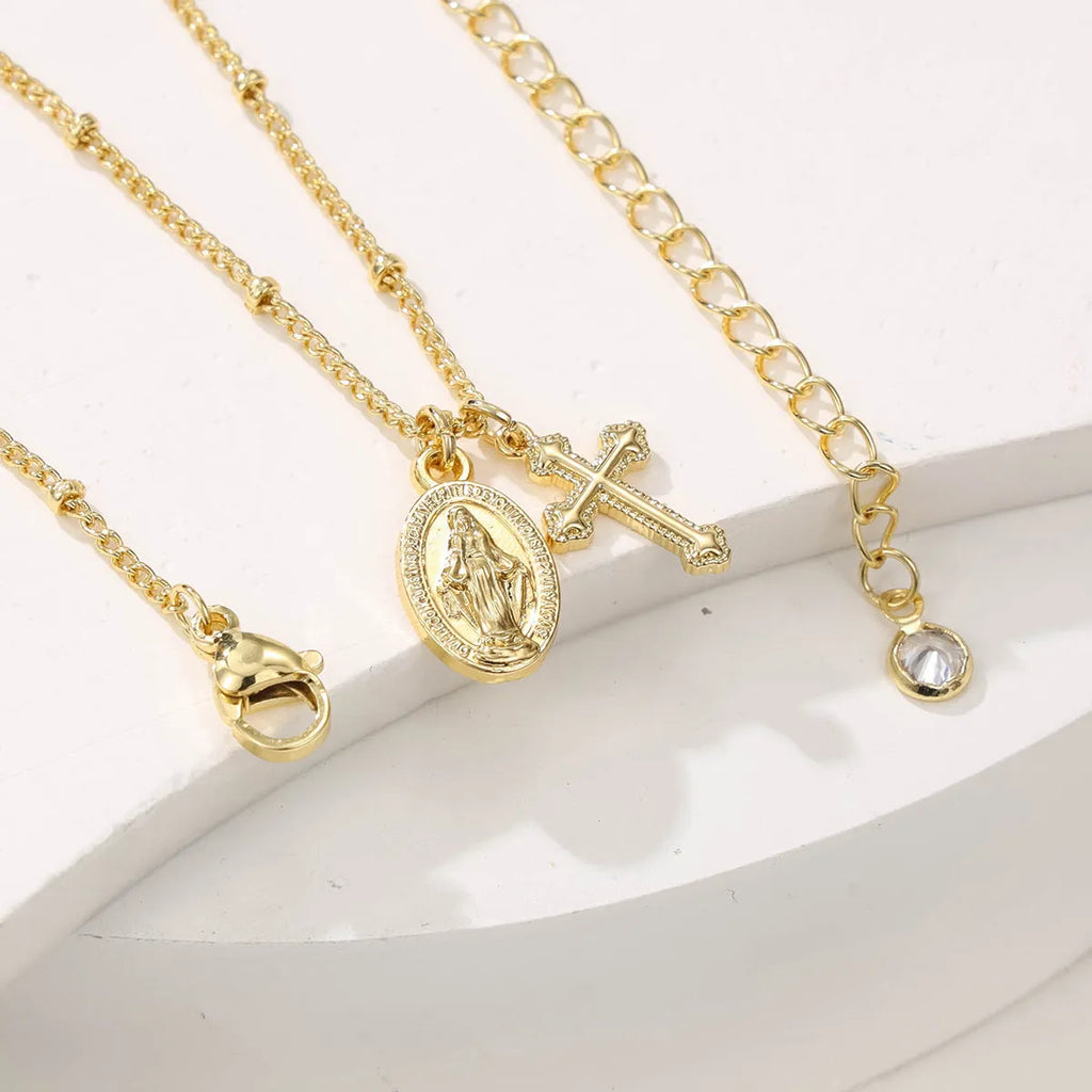 Virgin Mary cross necklace with geometric pendant in gold colour