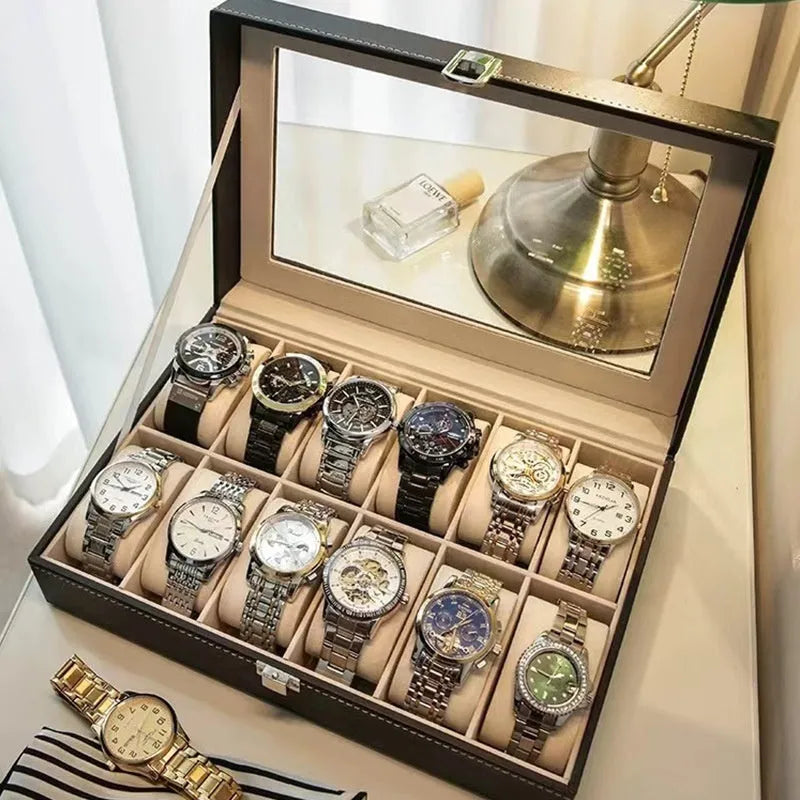 Grey leather watch storage box with transparent dustproof lid showing multiple watch slots inside