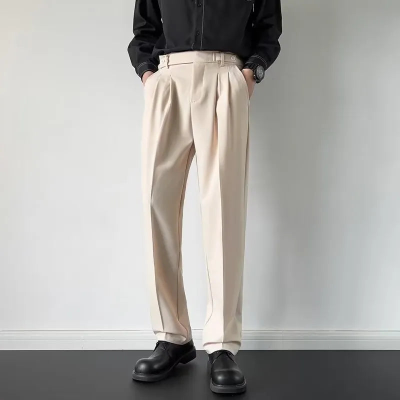 Men's apricot and black straight-leg loose fit suit trousers made from polyester fabric.