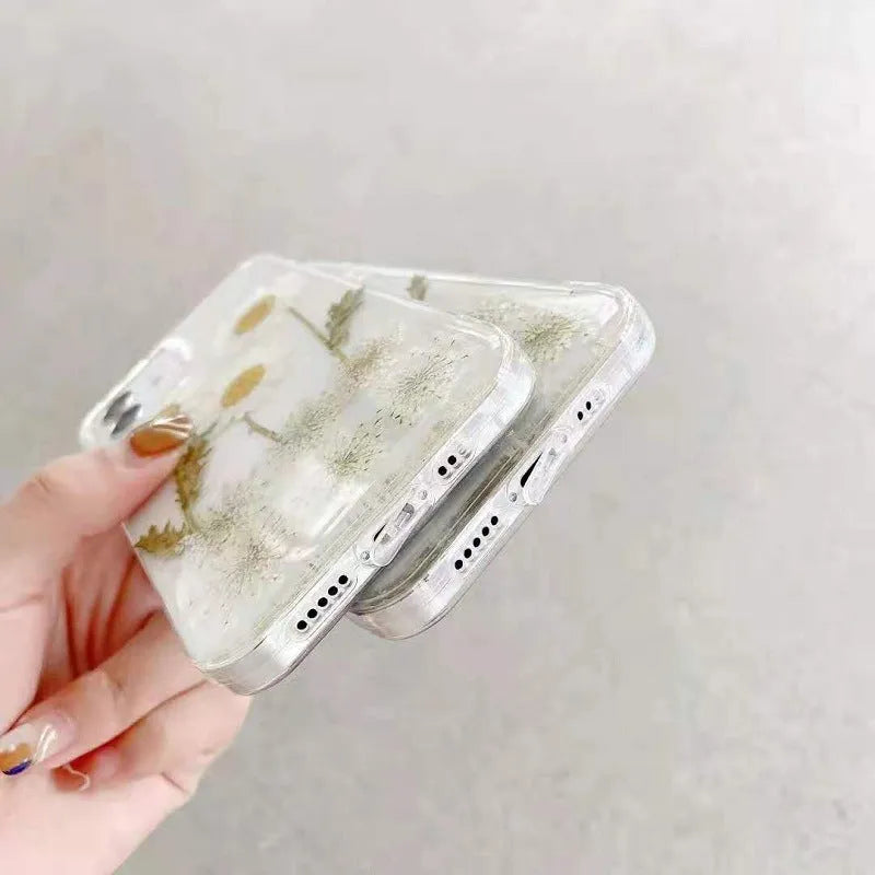 White TPU iPhone case with a raised epoxy daisy flower design on the back