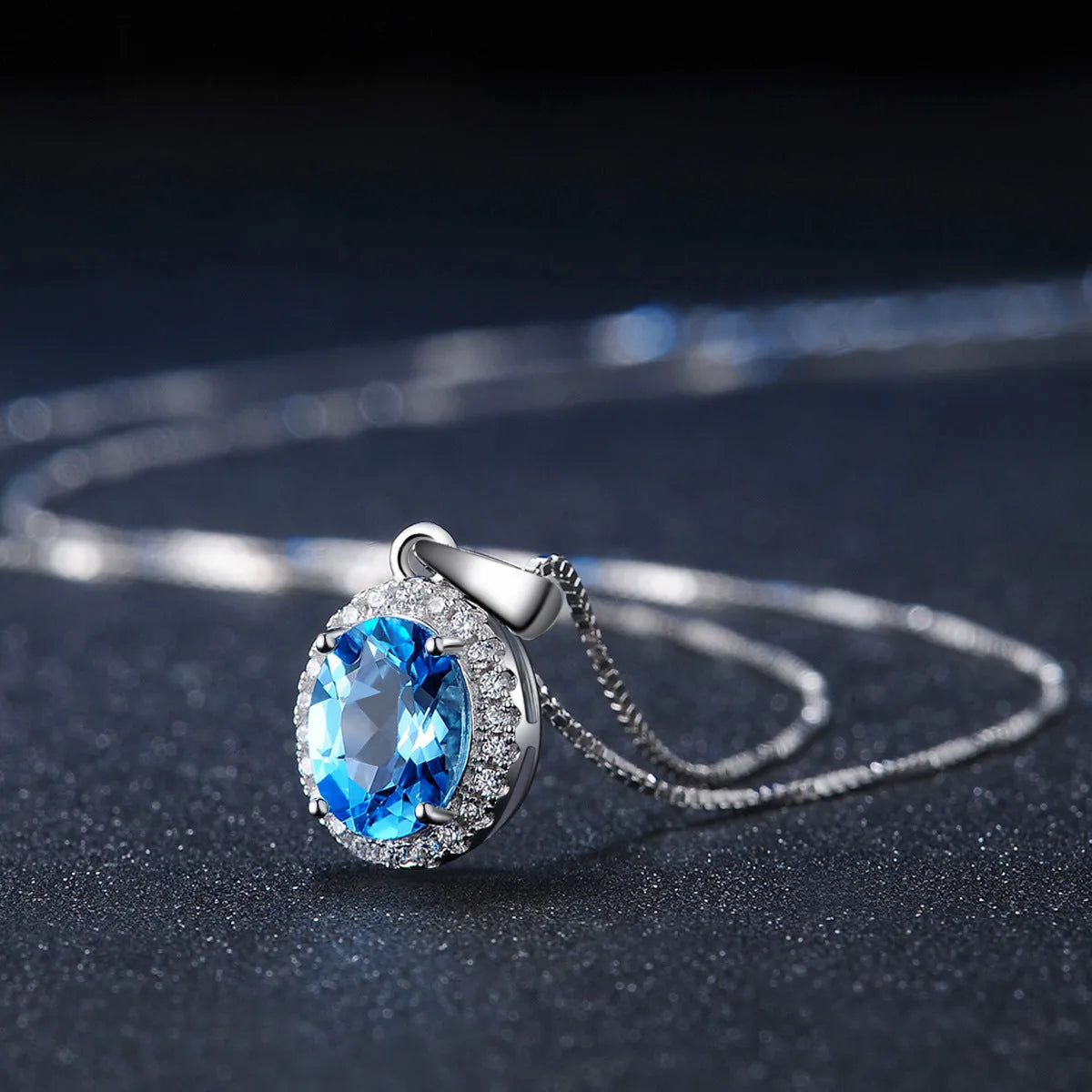 925 sterling silver blue topaz jewellery set with geometric design including earrings, necklace, ring and pendant