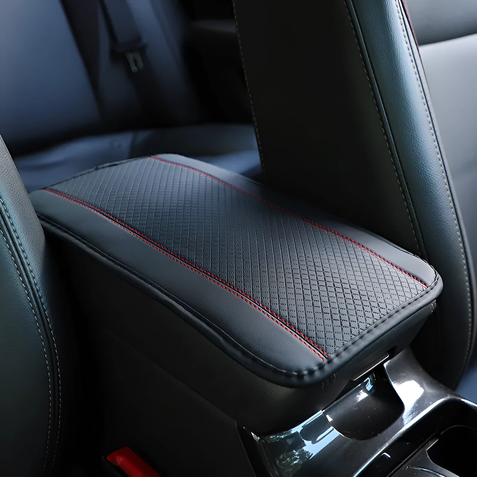 Black embossed PU leather car armrest box mat measuring 32 by 19 centimetres.