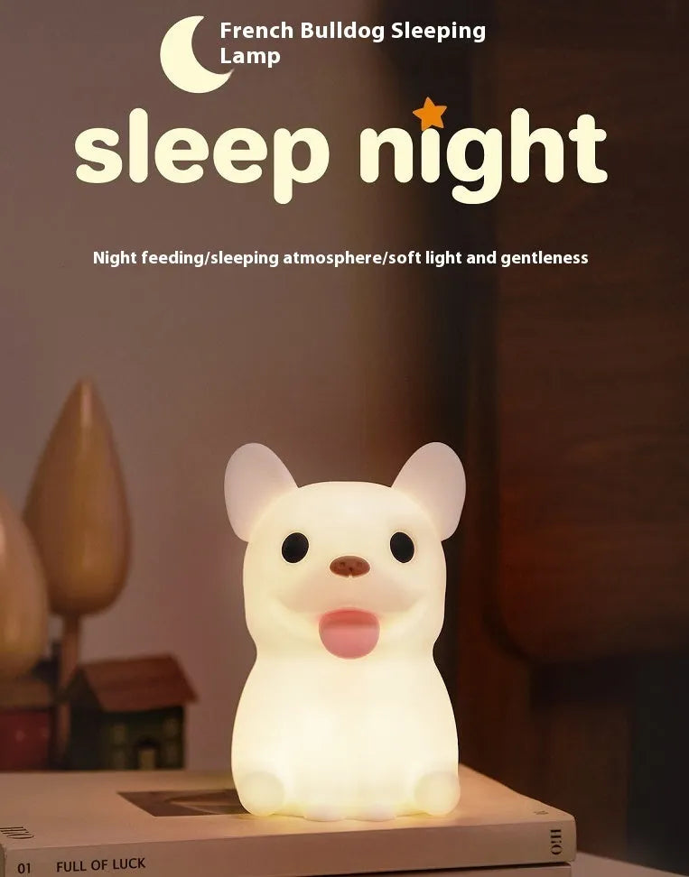 Silicone animal-shaped USB night light with touch dimming on a bedside table.