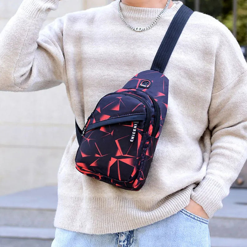Medium blue crossbody chest bag for men with a visible earphone hole and zipper opening.