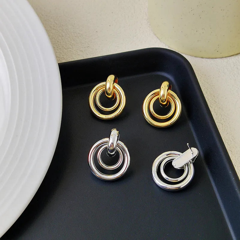 Geometric round ring earrings with irregular design in gold and silver electroplated finishes