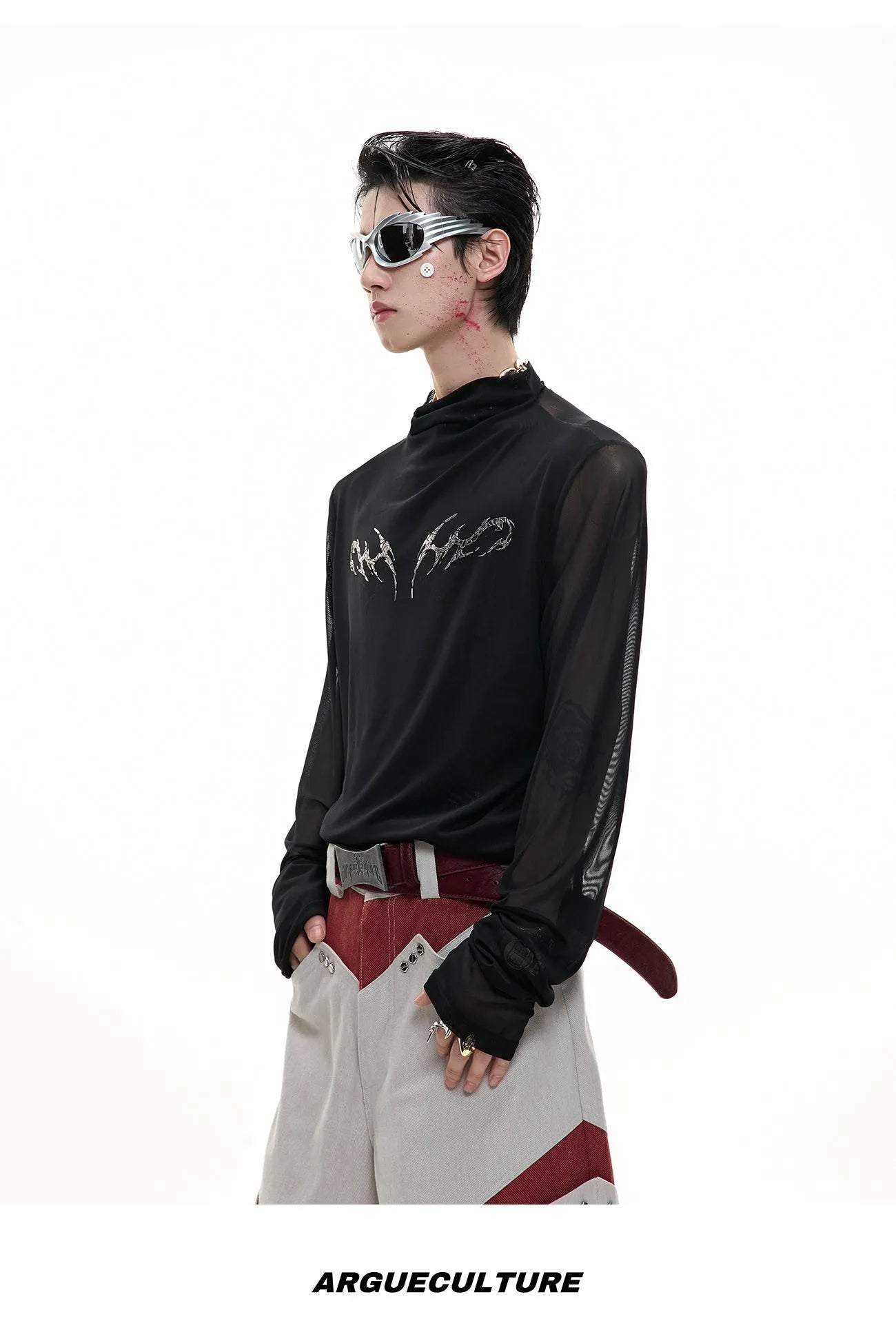 Man wearing a black slim fit long sleeve ice-feel top made from polyester and spandex blend.