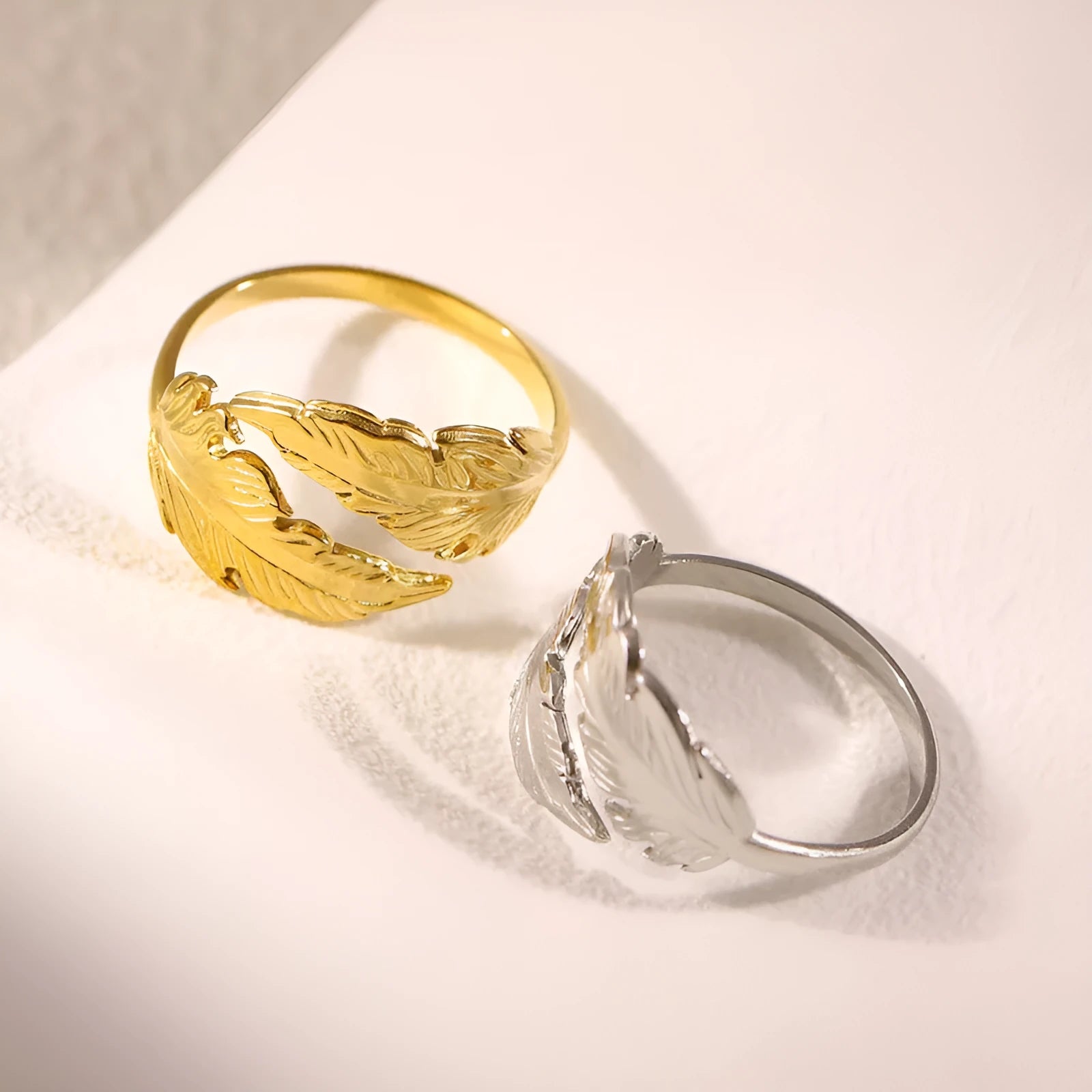 Women's adjustable stainless steel feather ring in gold and silver colour options