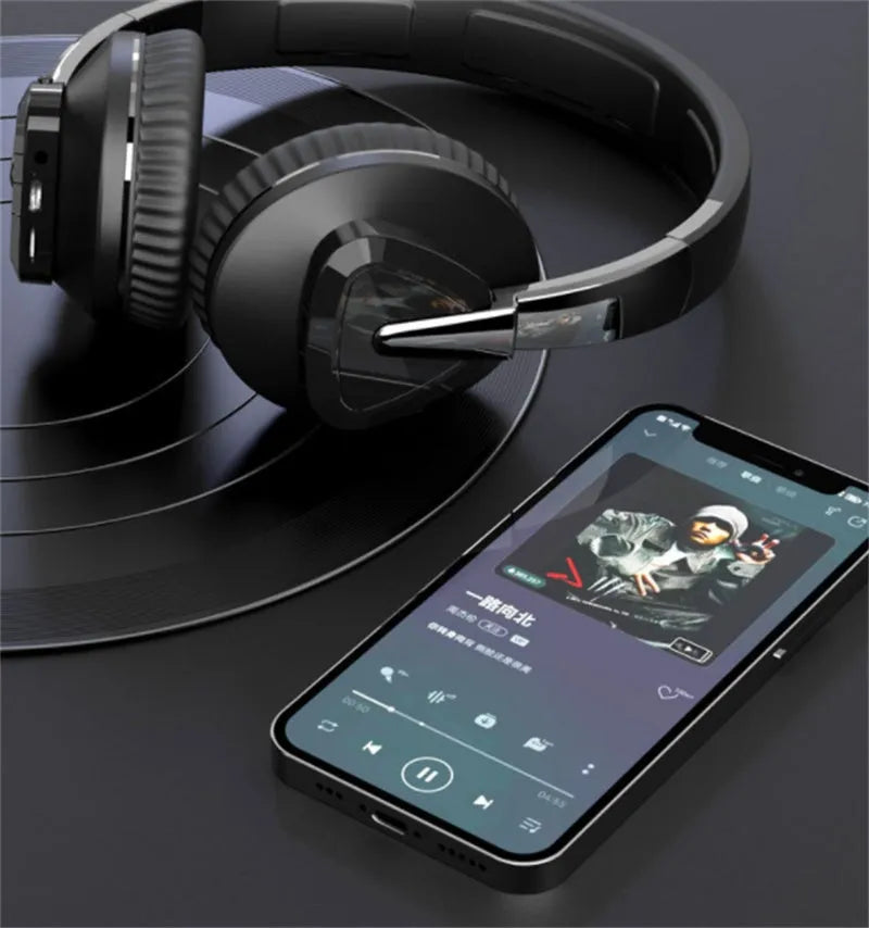 Wireless Bluetooth over-ear headphones in black colour with all-inclusive ear design showing AUX port and control buttons