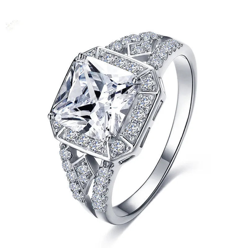 Geometric hollow design zircon ring with platinum colour finish on copper band