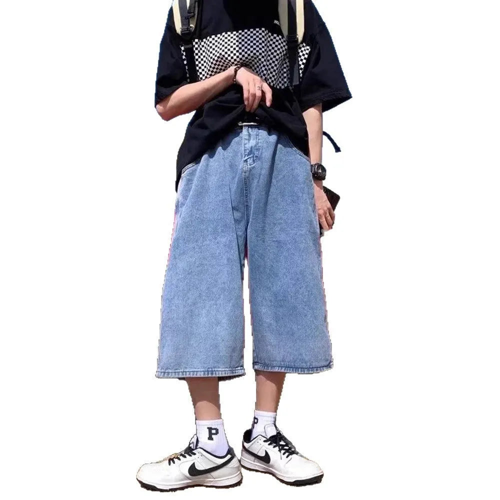 Blue men's high-waist denim pirate shorts with a cropped length and zipper fly.