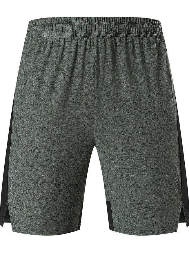 Man wearing forest green spandex five-point casual shorts, showing mid-waist fit and shorts length.