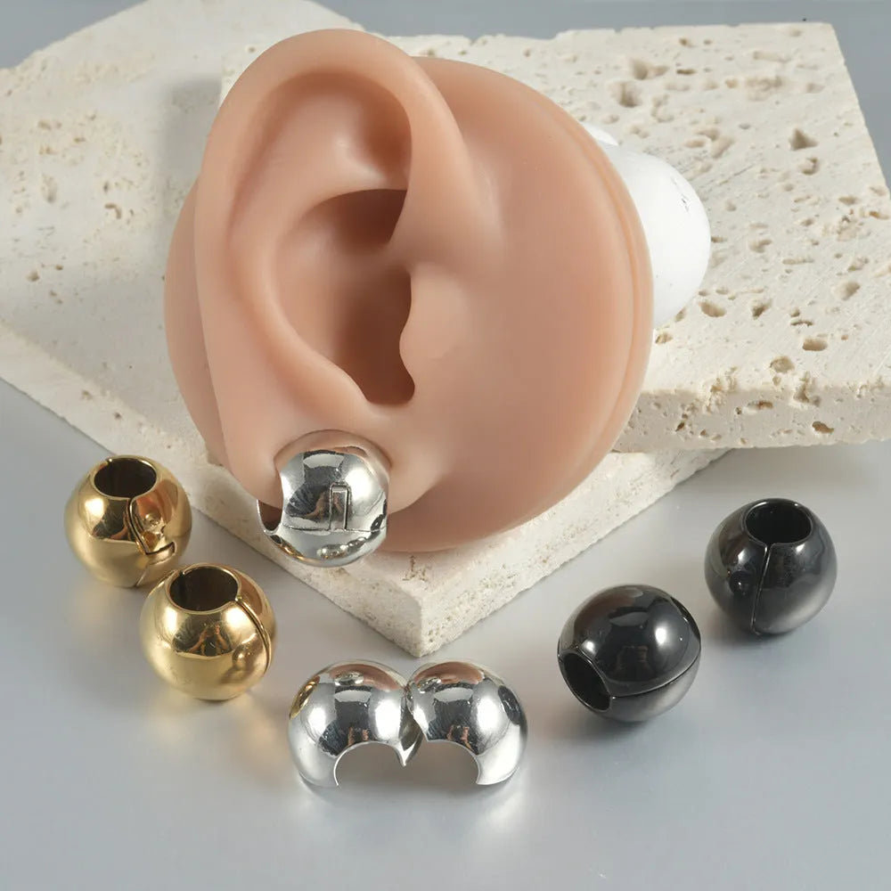 Stainless steel geometric earrings with hollow skull and Buddha head design in gold, black, steel, or Buddha head finish.