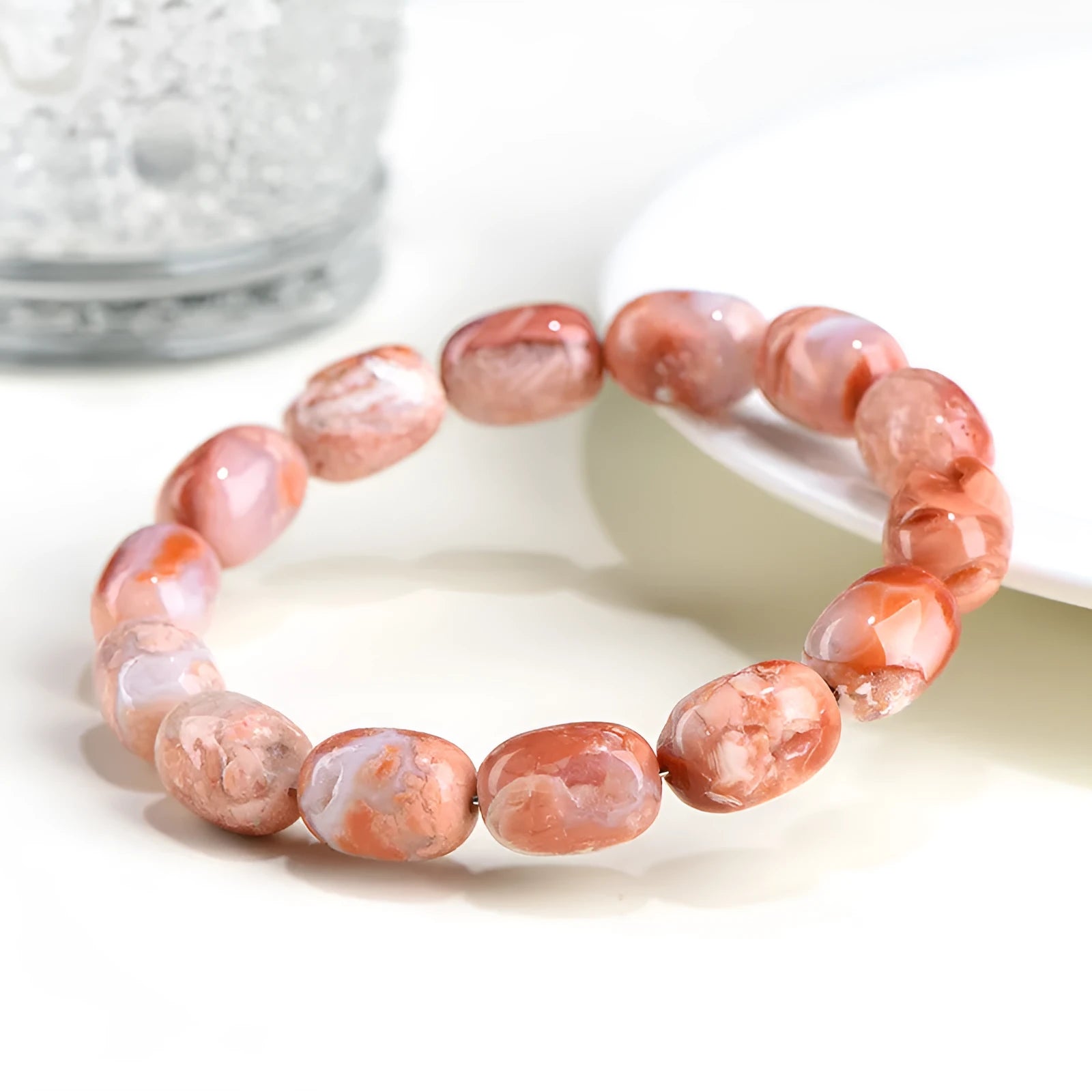 Natural cherry agate bracelet with 10x14mm barrel beads and Ruyi geometric elements
