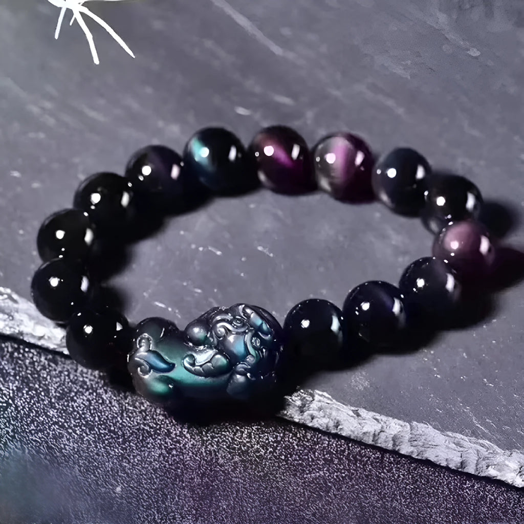 Natural ice colour eye obsidian crystal bracelet on wrist showing bead detail.