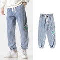 Men's loose-fit tapered cotton trousers in black, blue, or grey colours