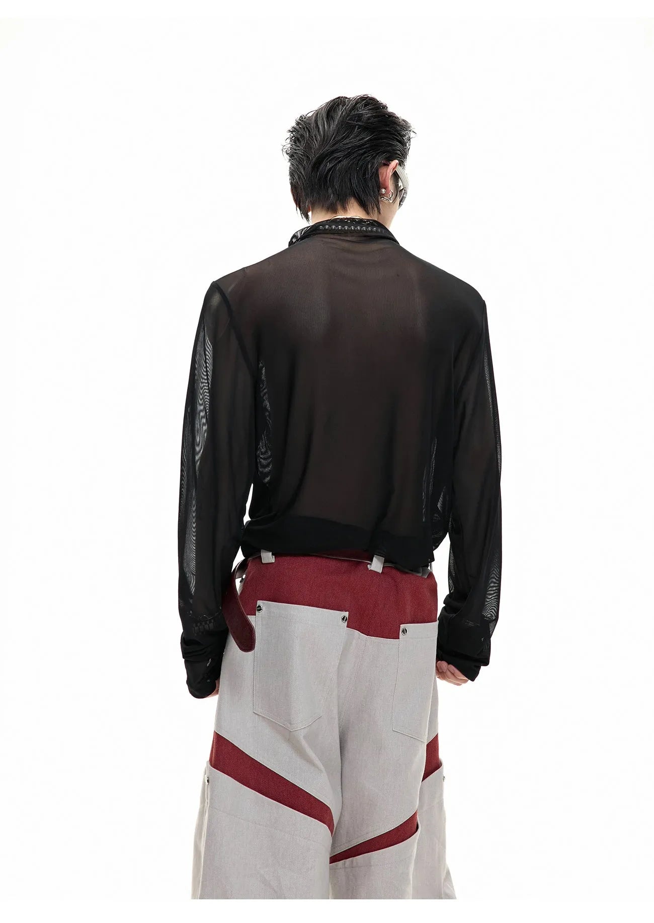 Man wearing a black slim fit long sleeve ice-feel top made from polyester and spandex blend.
