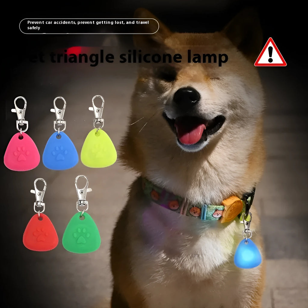 Silicone triangle-shaped light-up pendant for pet costumes in red, pink, blue, green, and yellow colours.