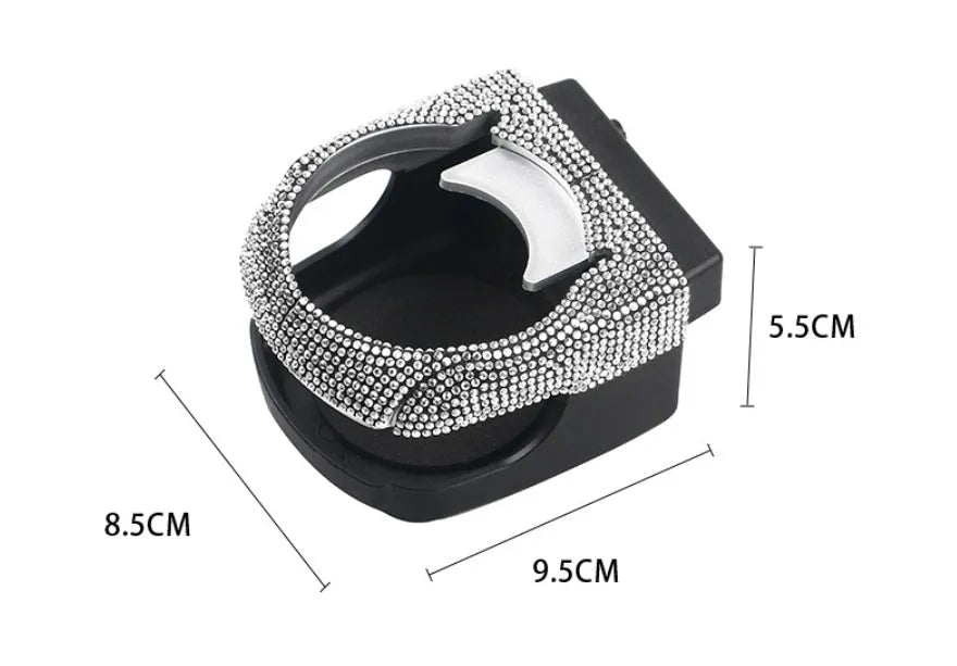 White rhinestone-encrusted car cup holder clipped onto a vehicle air vent.