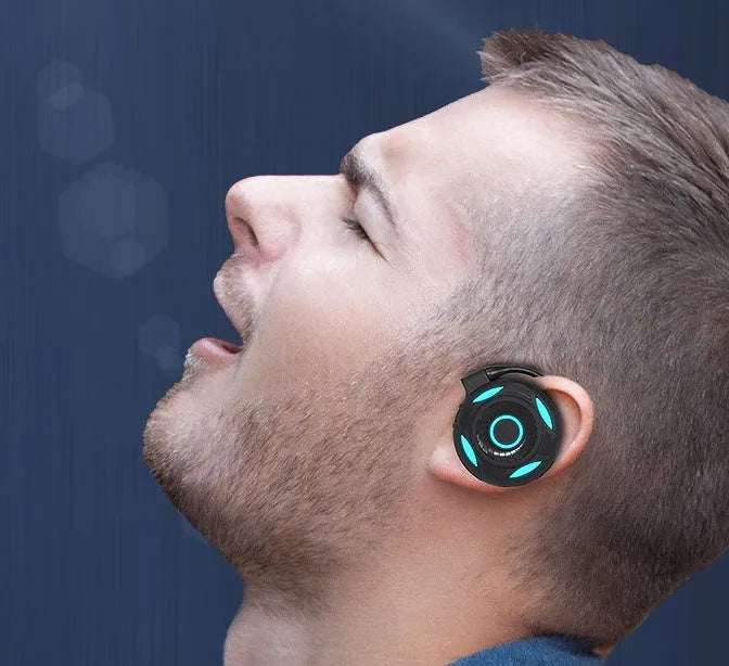 Black and white wireless Bluetooth earphones with hanging ear design