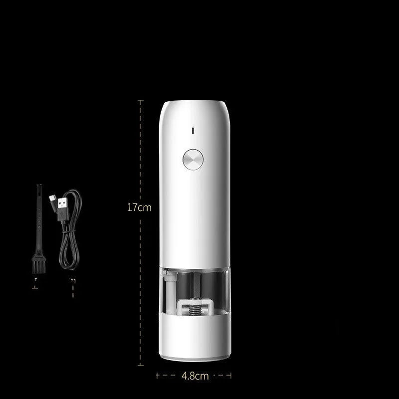 Black and silver electric salt and pepper grinders with clear acrylic bodies on a kitchen counter.