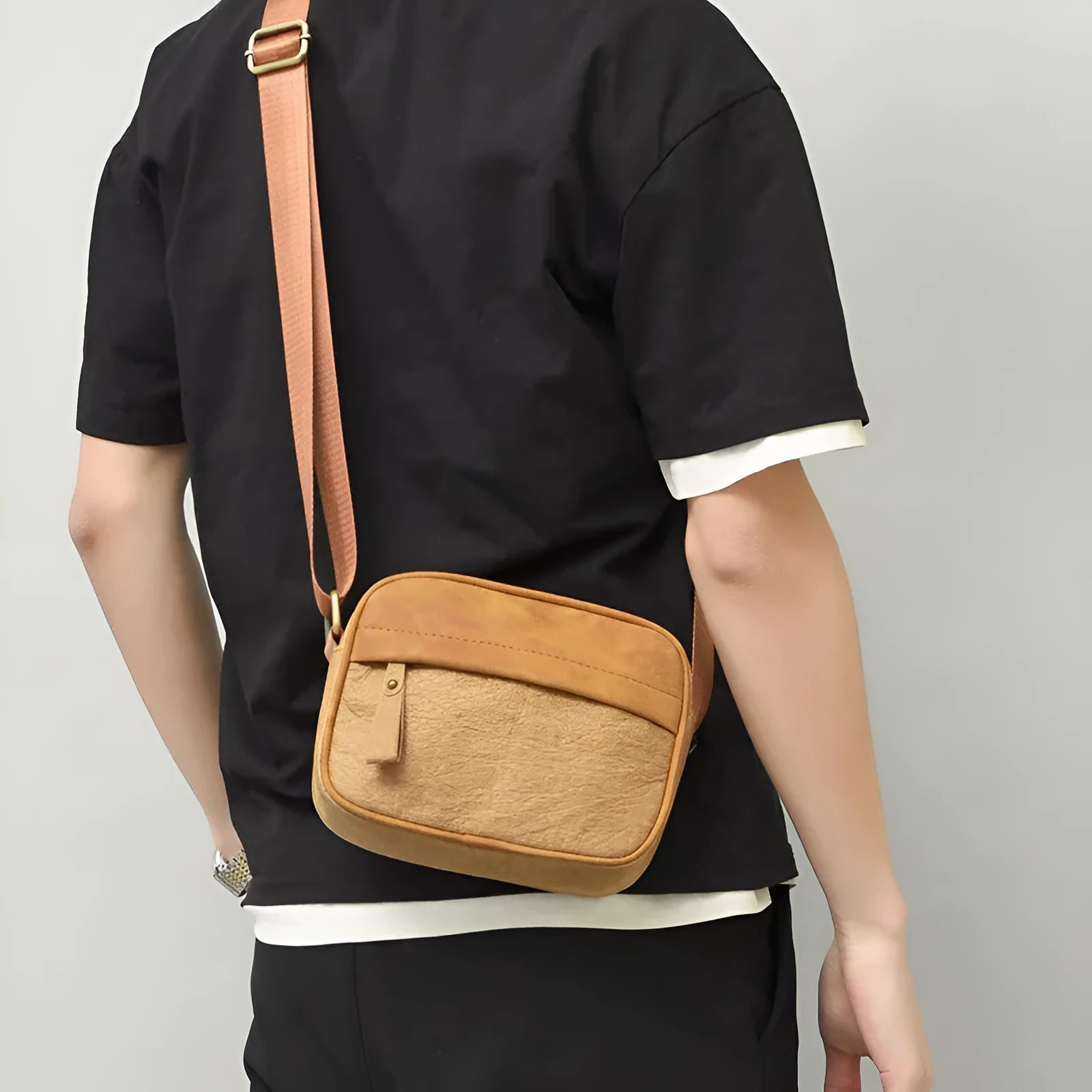 Men's retro style paper crossbody bag in black, brown, and silver colour options.