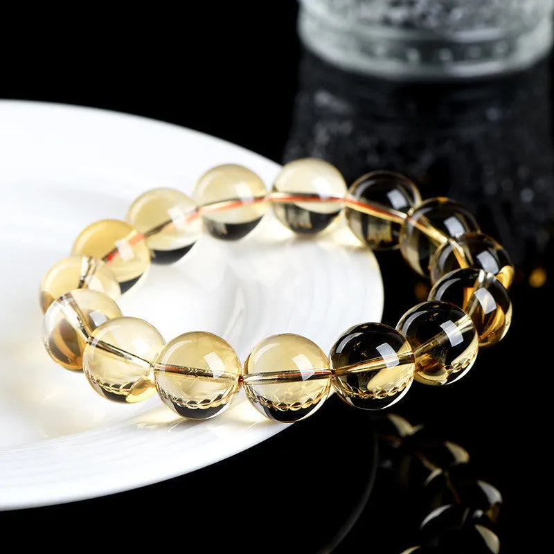 Natural citrine scattered beads ball bracelet on a wrist, showing polished stones in a choice of colours and sizes.