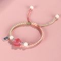 Red cat's paw charm couple bracelet in pastoral woven style with pink or yellow options
