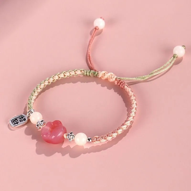 Red cat's paw charm couple bracelet in pastoral woven style with pink or yellow options