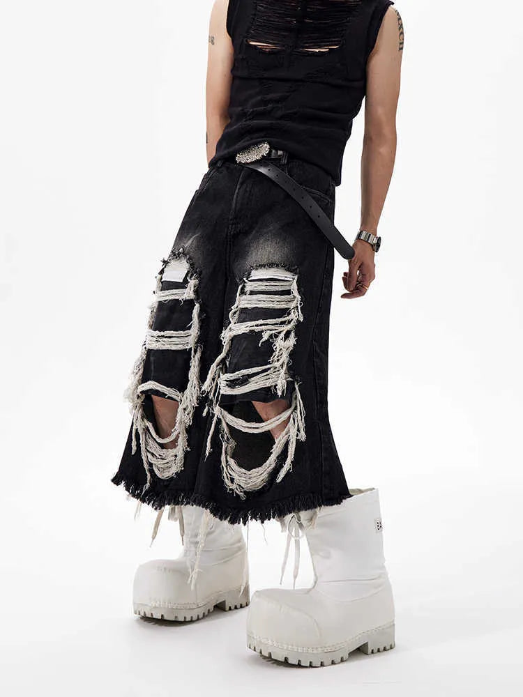 Black women's cropped wide-leg jeans with ripped patch detail and a mid-high waist