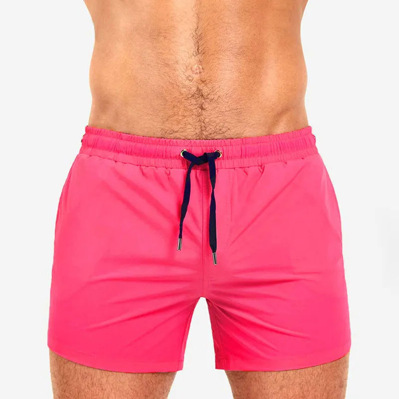 Men's solid colour swimming shorts with mesh lining in army green, shown on a white background.