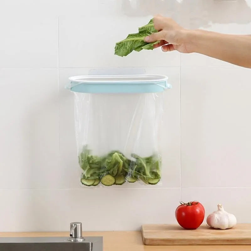 Blue plastic T-shaped garbage bag storage rack on a kitchen counter.